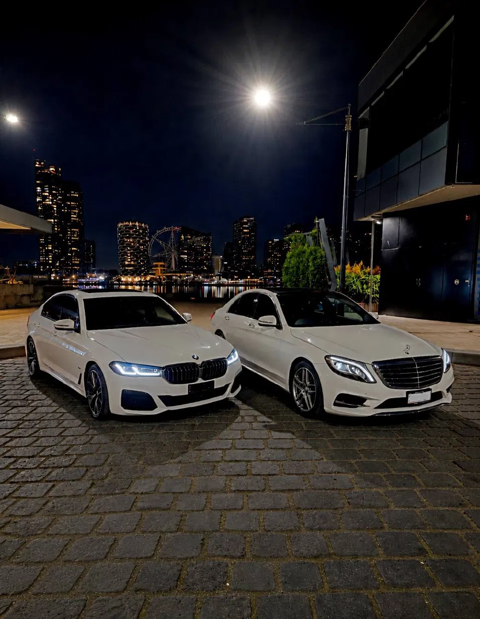 Superlative Shuttles chauffeur-driven fleet at night